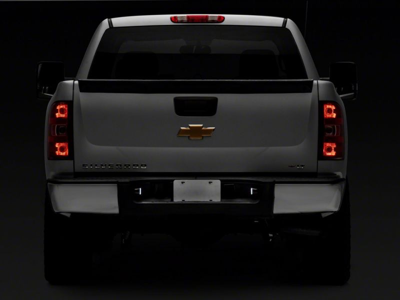 Raxiom 01-13 Chevrolet Silverado/GMC Sierra 1500 Axial Series LED License Plate Lamps- Smoked