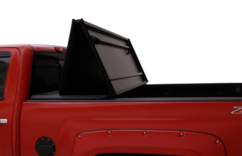 Lund 04-15 Nissan Titan (6.7ft. Bed) Hard Fold Tonneau Cover - Black