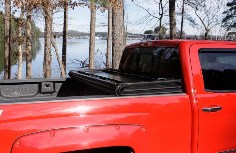 Lund 04-14 Chevy Colorado Styleside (5ft. Bed) Hard Fold Tonneau Cover - Black