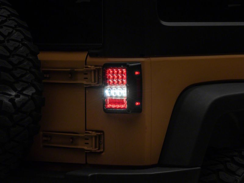 Raxiom 07-18 Jeep Wrangler JK Axial Series Lux LED Tail Lights- Blk Housing (Clear Lens)