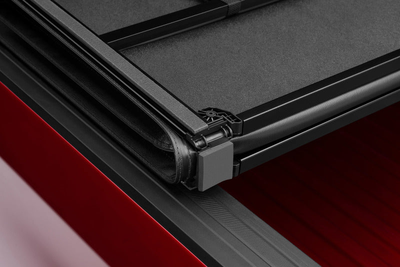 Lund 05-10 Dodge Dakota Fleetside (6.5ft. Bed) Hard Fold Tonneau Cover - Black