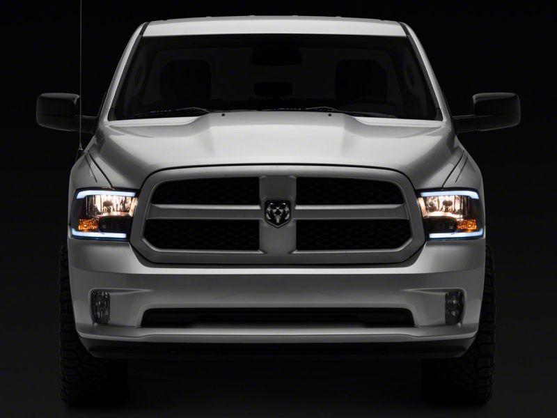 Raxiom 09-18 Dodge RAM 1500/2500/3500 Axial Headlights w/ SEQL LED Bar- Blk Housing (Clear Lens)