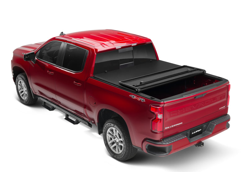 Lund 04-15 Nissan Titan (6.7ft. Bed) Hard Fold Tonneau Cover - Black